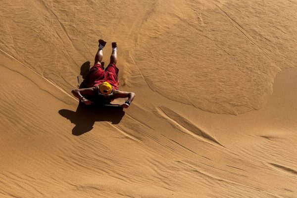 Sandboarding in desert